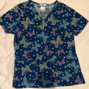 Four gently used XS scrubs